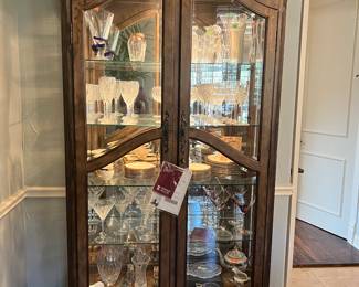 This is a really beautiful Howard Miller China hutch. It has a light in it that has two settings as well.