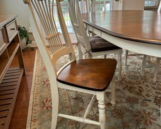 C5 - $350. Farm Style Dining Table with Leaf. 2 Captains Chairs 4 regular chairs. Measures 44" wide x 64" long + leaf is 18".  Top is in good condition but does have a few minor marks.  It includes the table protector. 