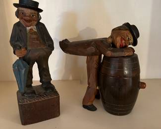 C47 - Left to Right. $20 Wooden Carved Statue. $30 as is - man and lid are not connected to the barrel. Cigarette Barrel?