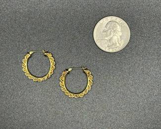 J16 - $100. Pair of 14 kt gold earrings. 