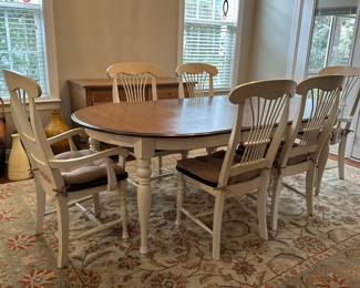 C5 - $350. Farm Style Dining Table with Leaf. 2 Captains Chairs 4 regular chairs. Measures 44" wide x 64" long + leaf is 18".  Top is in good condition but does have a few minor marks.  It includes the table protector. 