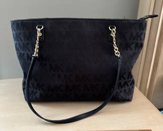 C58 - $40. Michael Kors bag in excellent condition! Doesn't look used. (Fabric exterior - not leather)