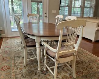 C5 - $350. Farm Style Dining Table with Leaf. 2 Captains Chairs 4 regular chairs. Measures 44" wide x 64" long + leaf is 18".  Top is in good condition but does have a few minor marks.  It includes the table protector. 