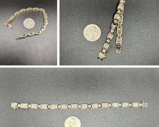 J27 - $1400. 14kt gold & diamond Pave Tennis Bracelet. Measures 7" long. With 3 locking safety features. 