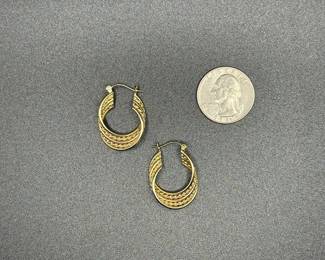 J15 - $160. Pair of 14 kt gold earrings. 