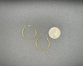 J21 - $150. Pair of 1" Gold Hoops. 