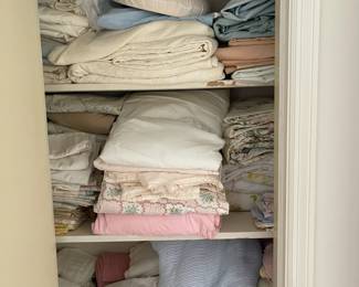 Many sheet sets and towels