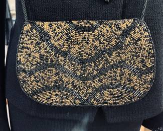 Love this beaded bad paired with a St. John Evening knit suit. 