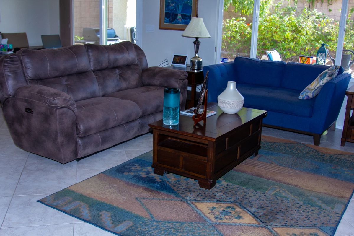 Plush reclining couch, upholstered love seat, and coffee table