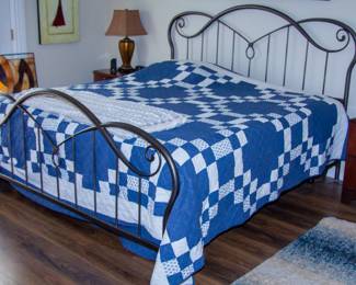 King size bed with intricate bedframe