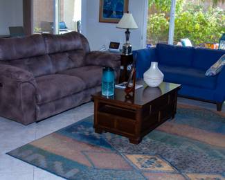 Plush reclining couch, upholstered love seat, and coffee table