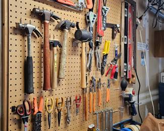 Assorted hand tools. Hammers, wrenches, pliers, levels, screwdriver, hacksaws,