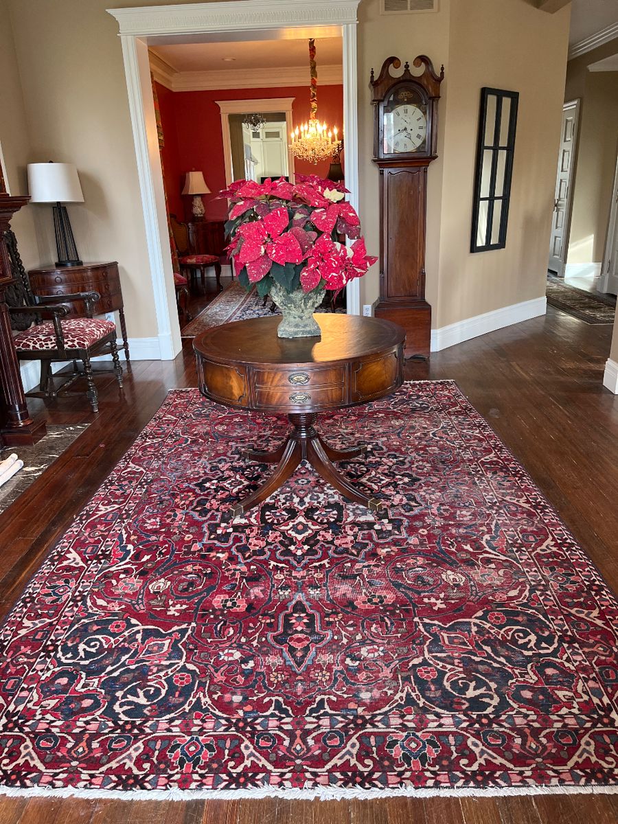 Foyer:  Welcome to this wonderful 3-story home in Clayton!  The large entryway includes an antique drum table, gorgeous rug, tall case clock, corner cabinet, and newer lamp.  Closer photos follow.