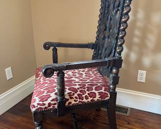 Foyer:  This is a view of the side of the antique Baroque armchair.  