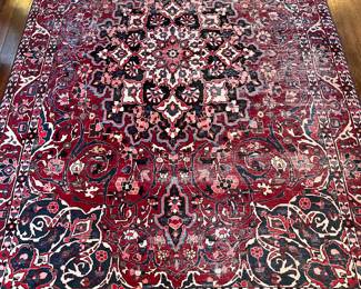 Foyer:  The deep red colors in this rug (6'  6"  x  10"  3") dominant the overall pattern.   A closer photo of one corner follows.