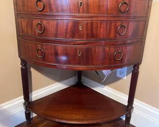 Foyer:  The antique corner chest will fool you . . . it does NOT have three drawers!  It is actually a door that opens over one lower drawer, as shown in the next photo.   The under-shelf is real though!