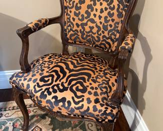 Living Room:  This is one of the two separately priced antique French Louis XV-style armchairs.  The fabric is a raised velvet animal print.  The next photo shows the back of the chair.