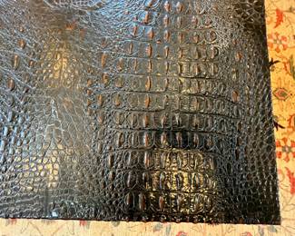 Living Room:  The JOHN-RICHARD campaign-style table has a faux alligator top.