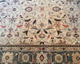 Living Room:  This Afghan rug has subtle colors of teal and terracotta in its border and in the cream field.  It measures 12' x 14.'   The next photo shows a corner of the rug.