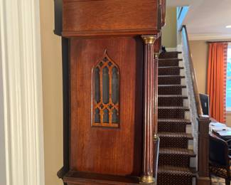 Foyer: Notice the Gothic screen design on the antique tall case clock's side. The screen allows the bells to be  heard.