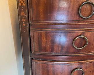 Foyer:  The inlay on each side of the corner chest includes string banding around bellflowers. 