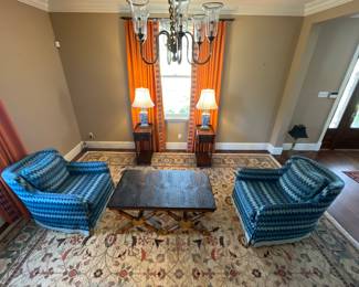 Living  Room:  An overview of this room shows a large Afghan rug, antique side tables, lamps, a cocktail table, and two club chairs!  Closer photos follow.