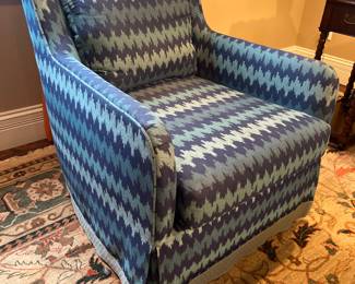 Living Room: This is one of two separately priced club chairs in a "Calypso Blue Turbo Charge" upholstery.   Each chair has "border French seam feather lux" seat and back cushions.  There is also a Waterfall skirt with a 3" celadon tape border at the bottom of the skirt. Each chair is eight-way hand tied.  More photos of the chair follow.