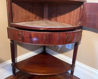 Foyer:  The antique chest door and one drawer are now open to reveal storage space.  Photos of the design follow. 