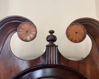 Foyer:  The top of the clock has inlay on its scroll bonnet.