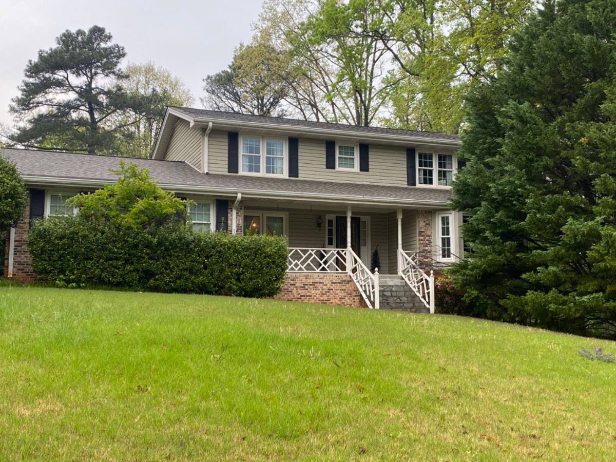 Please do not walk in grass, yard uneven.  Enter through the garage.