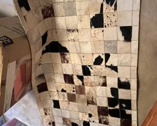 #172	Cowhide patchwork rug 4x6	 $90.00 
