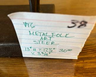 #38		Vtg. Metal Folk Art Steer - 13"H x 12.5" x 3.75"	 $30.00 			
