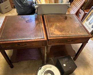 #187	Table	Genuine Mahogony leather top square end table with one drawer, protective glass top.  21 x21 23 As is leather.  Set of two.	 $150.00 			
