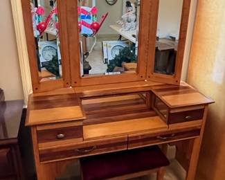 #182	cabinet	Midcentury vanity, 4 drawers, with stool.  Beveled glass trifold mirror.  42x18x32.  Mirror 41x31	 $200.00 			
