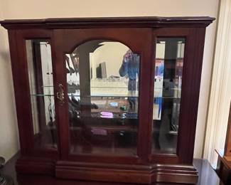 #180	Cabinet	Display cabinet with 1 beveled glass door, Mirror back.  34 x 10 x 29 tall	 $175.00 			
