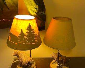 #193	Lamp	Set. Bear and Bison lamps.  Shade scenery when lit.  	 $40.00 			
