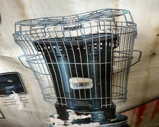 #115	Garage	Dyna Glo convection kerosene heater.  New. Box has water damage	 $40.00 
