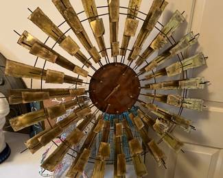 #171	Clock	Copper and brass  clock,  Signed, Ymmuns.	 $75.00 			
