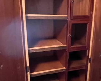 #184	inside Vintage armoire with two doors. 6 shelves, 2 glass door cabinets 36x18x72	 $125.00 
