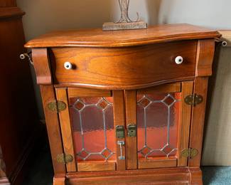 #54	Keepsakes Pulaski Cabinet w/2-stained Glass Doors & 1 drawer (as is finish) - 30x20x28 w/side towel racks	 $125.00 			
