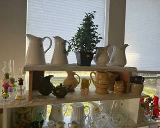 All kinds of Pitchers all sizes, shapes, and time pieces