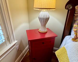 Small red table, two white wicker lamps