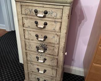Tall occasional cabinet with drawers