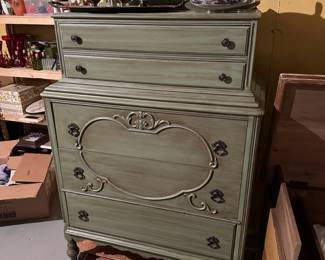 5-drawer green cabinet with metal pulls, on casters