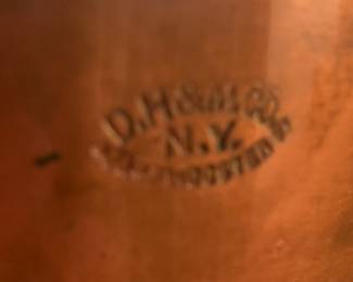 Embossed on saucepan and lid of copper pan