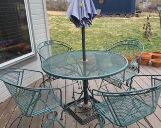 Wrought iron table, 4 chairs and umbrella with stand