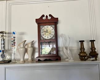 Racing trophy. 
Thermometer. 
Windup click. 
Pair of egrets. 
Pair of urea. 
Pair of fire nozzel candle holders. 