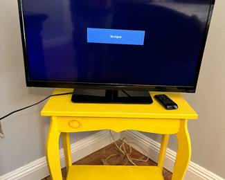 Vizio TV. 
Yellow table. 