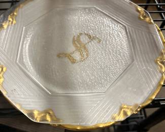 glass and white plate with S
