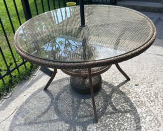 glass top wicker patio table.